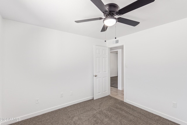 carpeted empty room with ceiling fan