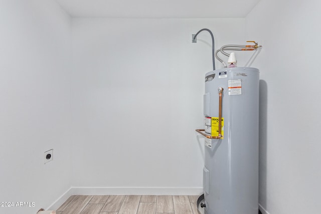 utility room with water heater