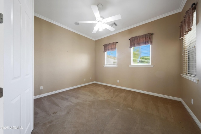 unfurnished room with ceiling fan, carpet floors, visible vents, baseboards, and ornamental molding