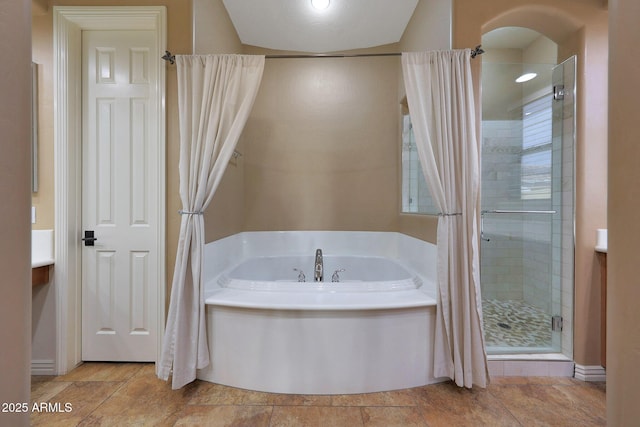 full bath with a garden tub and a shower stall