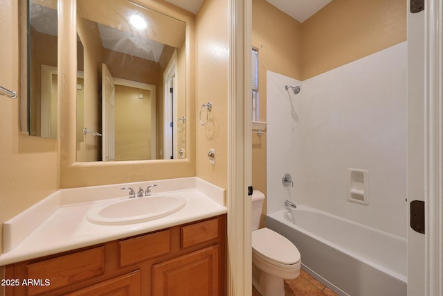 bathroom featuring tub / shower combination, vanity, and toilet