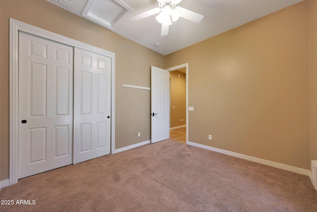 unfurnished bedroom featuring a ceiling fan, carpet, baseboards, and a closet