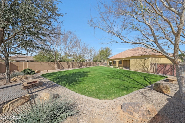 view of yard with a patio area and a fenced backyard