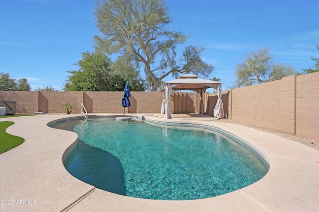 view of pool featuring a fenced backyard, a fenced in pool, and a gazebo