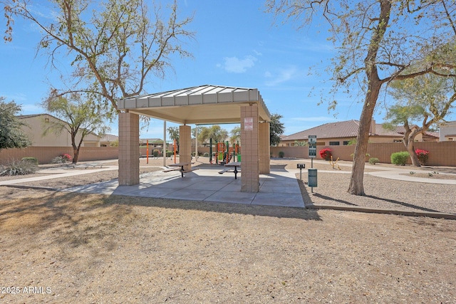 view of home's community with fence and a gazebo