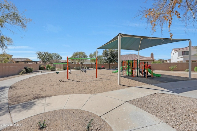 communal playground featuring fence