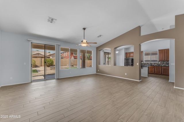 unfurnished living room featuring ceiling fan, light wood-style flooring, and visible vents