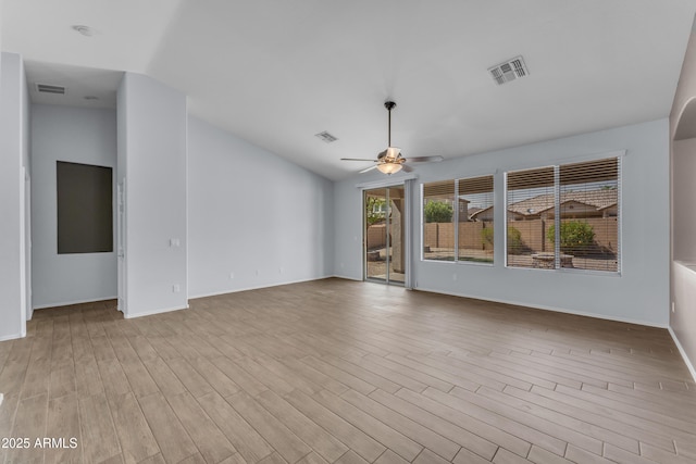 unfurnished living room featuring a ceiling fan, visible vents, and wood finished floors