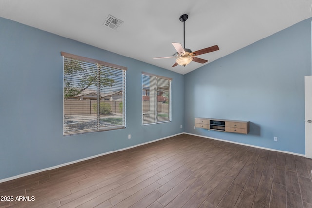 unfurnished living room with a ceiling fan, dark wood-style flooring, lofted ceiling, and visible vents