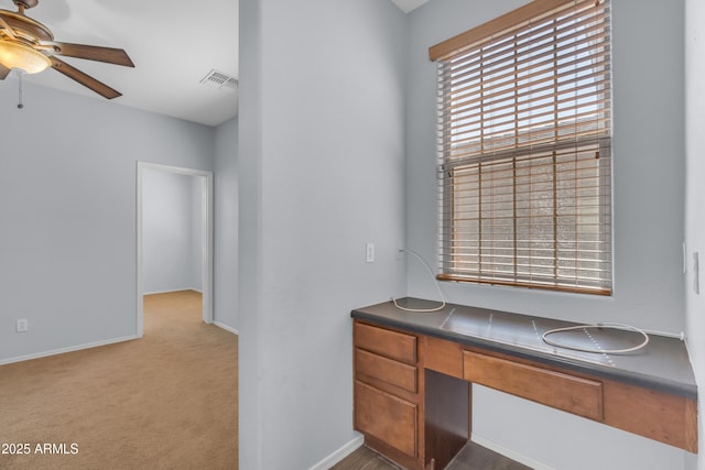 bathroom featuring a ceiling fan, baseboards, visible vents, and a sink