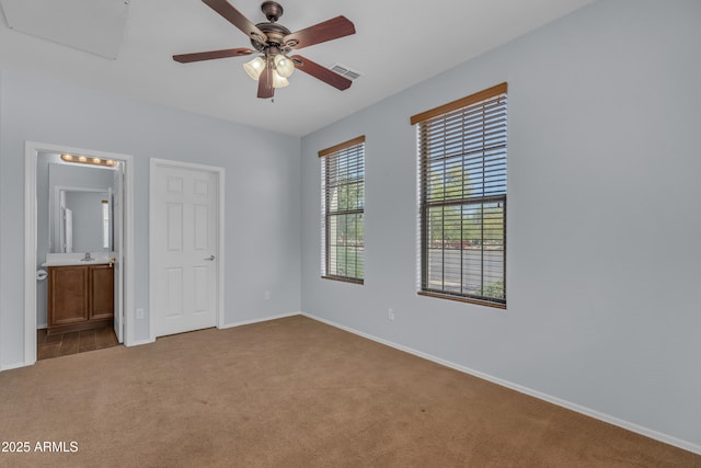 unfurnished bedroom featuring baseboards and carpet flooring