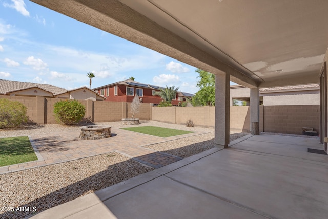view of patio / terrace featuring a fenced backyard and an outdoor fire pit