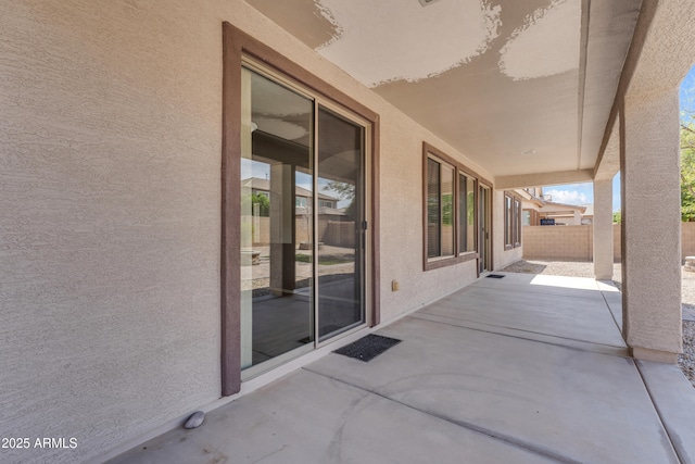 view of patio / terrace featuring fence