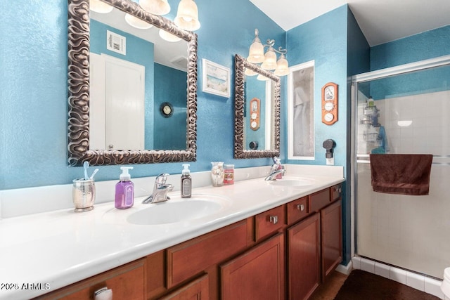 bathroom with vanity, toilet, and walk in shower