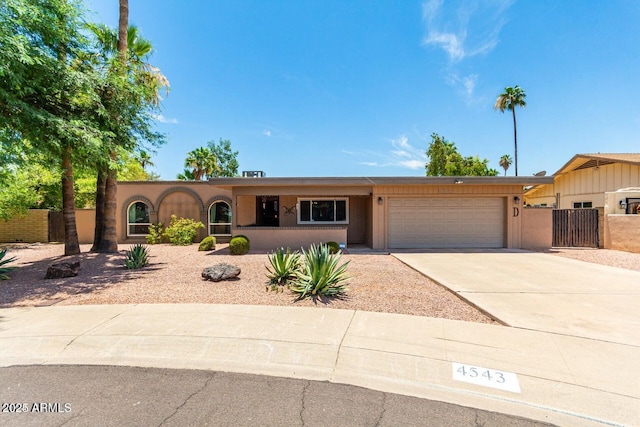 single story home featuring a garage