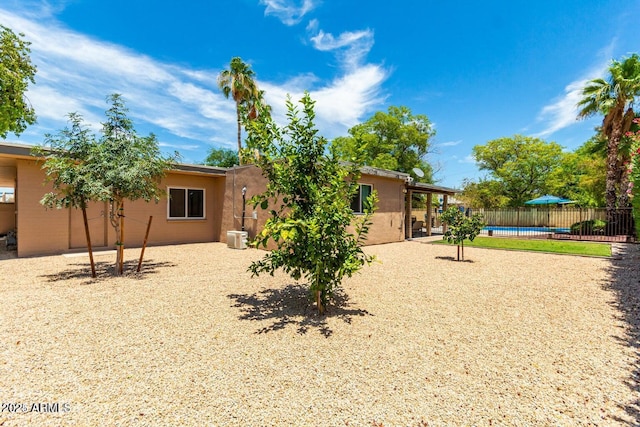 exterior space featuring a swimming pool and a patio area