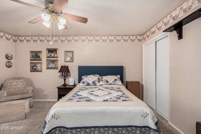 bedroom featuring a closet, ceiling fan, and carpet flooring