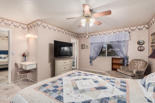 carpeted bedroom featuring baseboards and ceiling fan