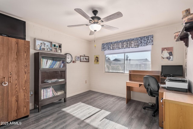 office area with ceiling fan, wood finished floors, and brick wall