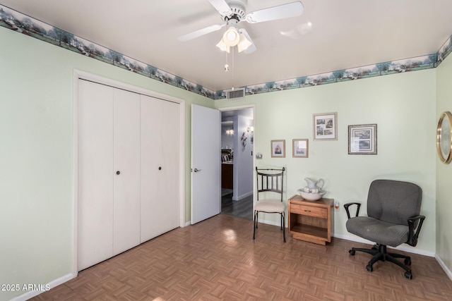 sitting room with baseboards, visible vents, and ceiling fan