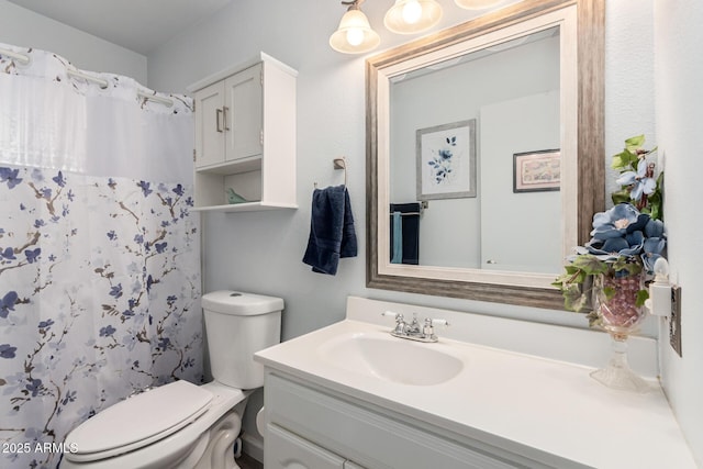 bathroom with a shower with shower curtain, toilet, and vanity