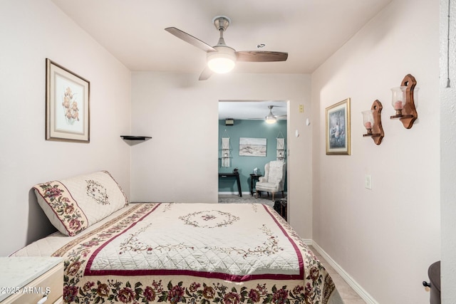 bedroom featuring baseboards and a ceiling fan