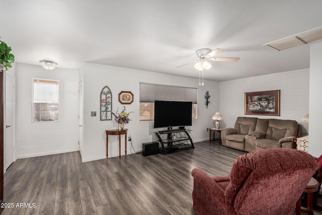 living room with wood finished floors, a ceiling fan, and baseboards