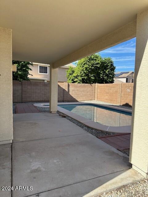 view of patio with a fenced in pool and a fenced backyard