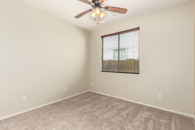 unfurnished room featuring ceiling fan and light colored carpet