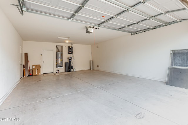 garage featuring water heater and a garage door opener