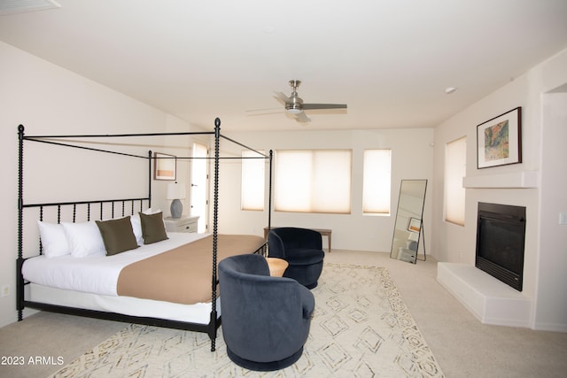 bedroom featuring ceiling fan and light carpet