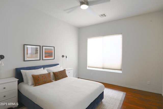 bedroom featuring dark hardwood / wood-style flooring and ceiling fan