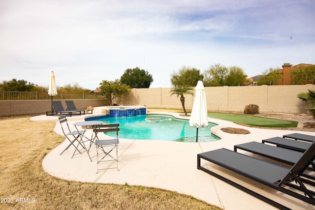 view of pool featuring an in ground hot tub and a patio