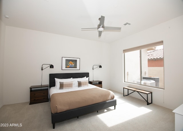 bedroom with light carpet and ceiling fan