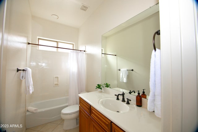 full bathroom featuring vanity, shower / tub combo with curtain, toilet, and tile patterned floors