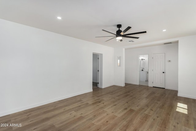 unfurnished living room featuring light wood-type flooring and ceiling fan