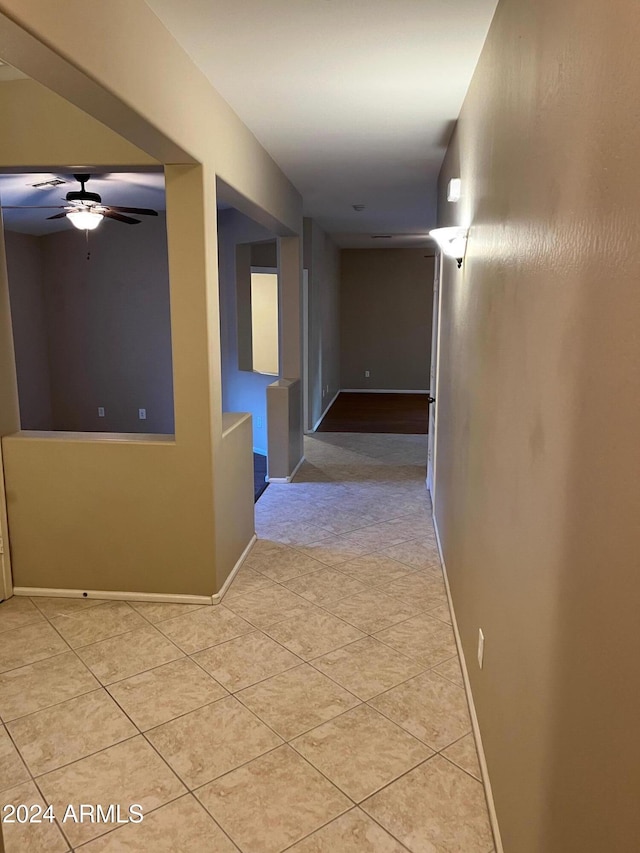 hallway with light tile patterned flooring