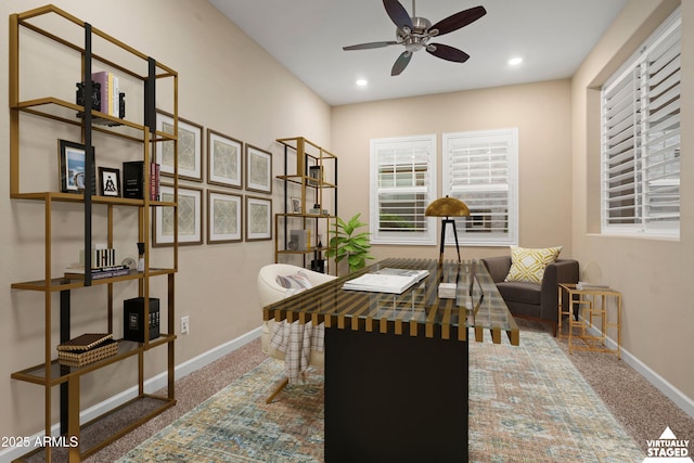 carpeted office space with recessed lighting, a ceiling fan, and baseboards