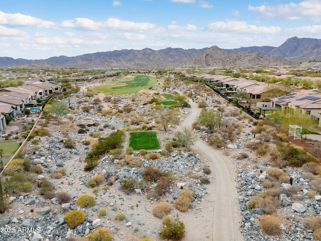 drone / aerial view featuring a residential view and a mountain view