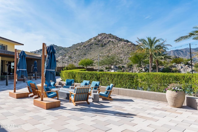 view of patio / terrace featuring a mountain view