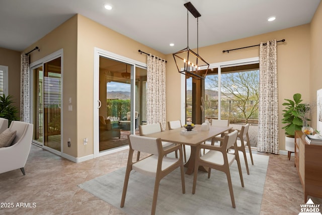 dining area featuring a chandelier, light tile patterned floors, recessed lighting, and baseboards