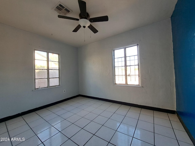 unfurnished room featuring ceiling fan and light tile patterned flooring