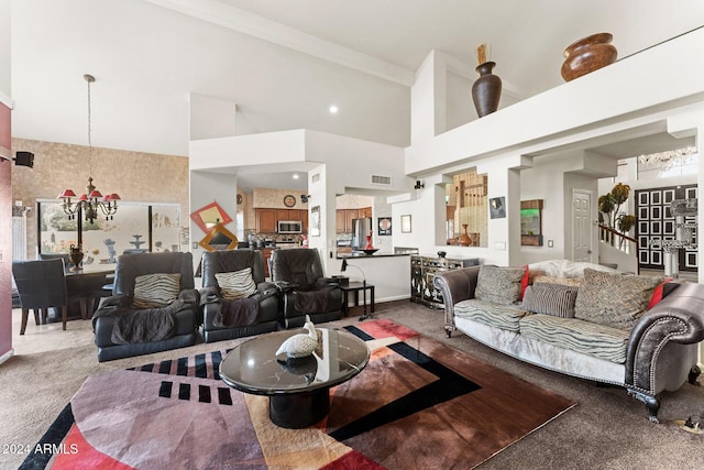 carpeted living room with a high ceiling, an inviting chandelier, and crown molding