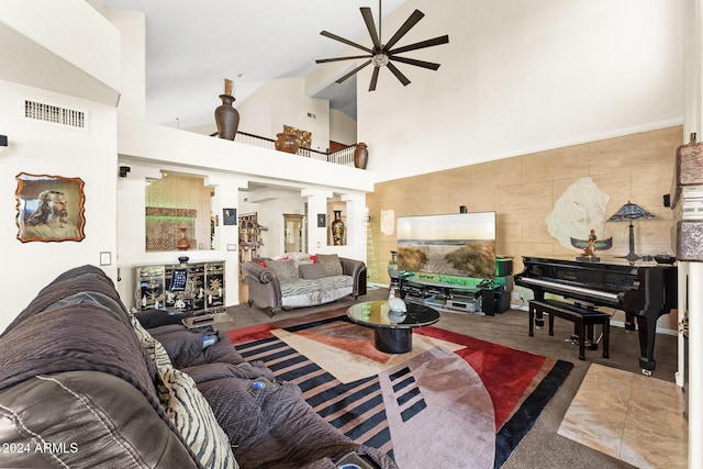 living room featuring tile patterned floors, high vaulted ceiling, and ceiling fan