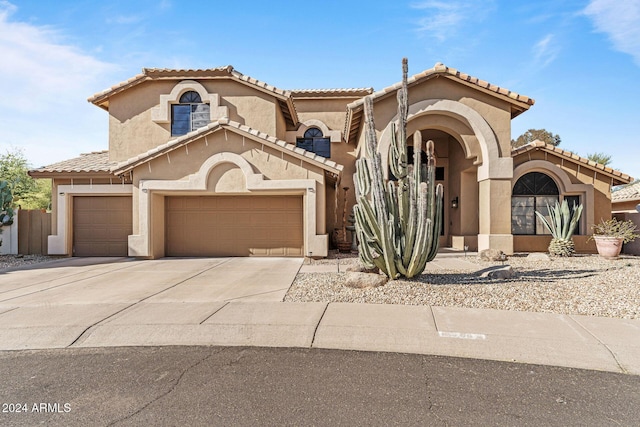 mediterranean / spanish-style house featuring a garage