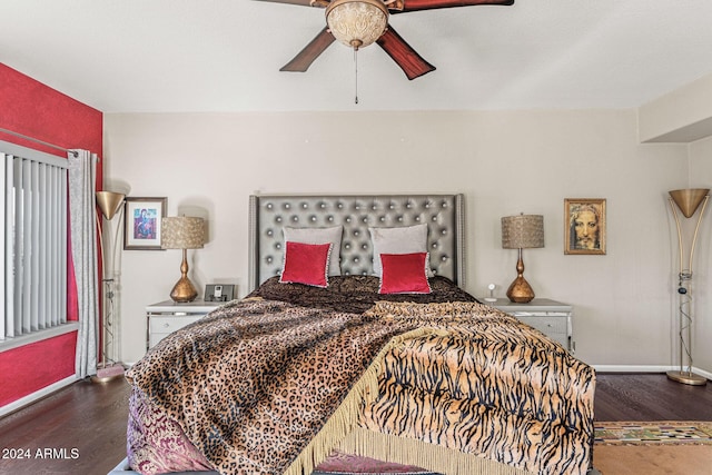 bedroom with ceiling fan and dark hardwood / wood-style flooring