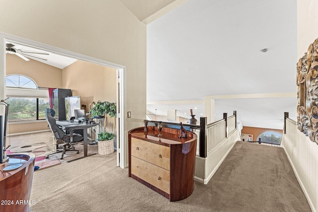 interior space with carpet flooring and vaulted ceiling