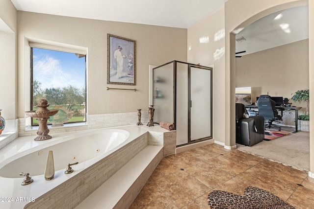 bathroom featuring plus walk in shower and vaulted ceiling