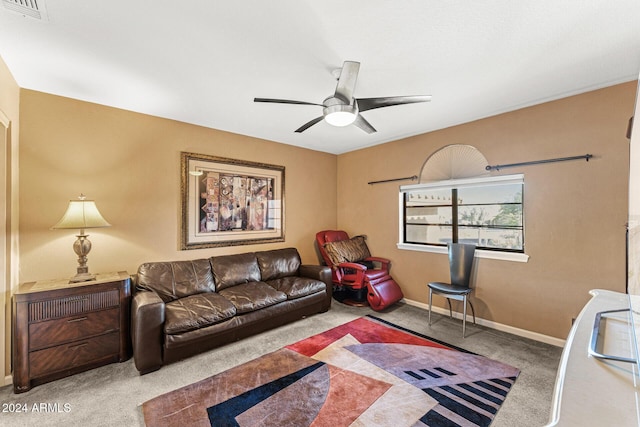 carpeted living room with ceiling fan