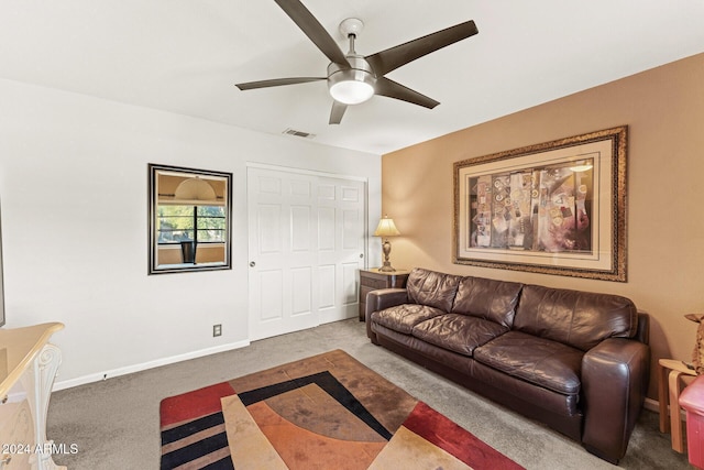 carpeted living room featuring ceiling fan